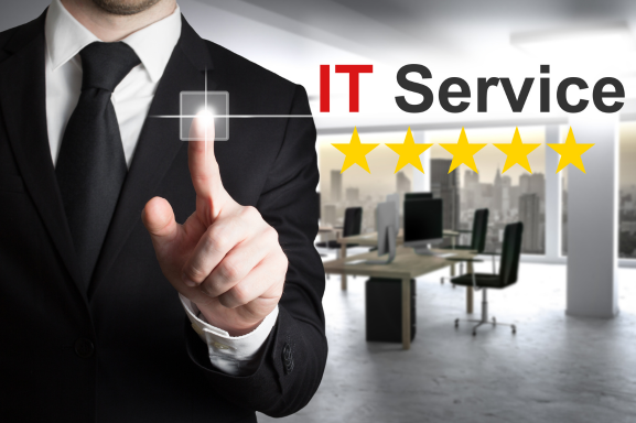 A business professional in a suit pointing to a virtual button with five stars and the text 'IT Service' in the background. This image represents high-quality IT Services, emphasizing professionalism and customer satisfaction.